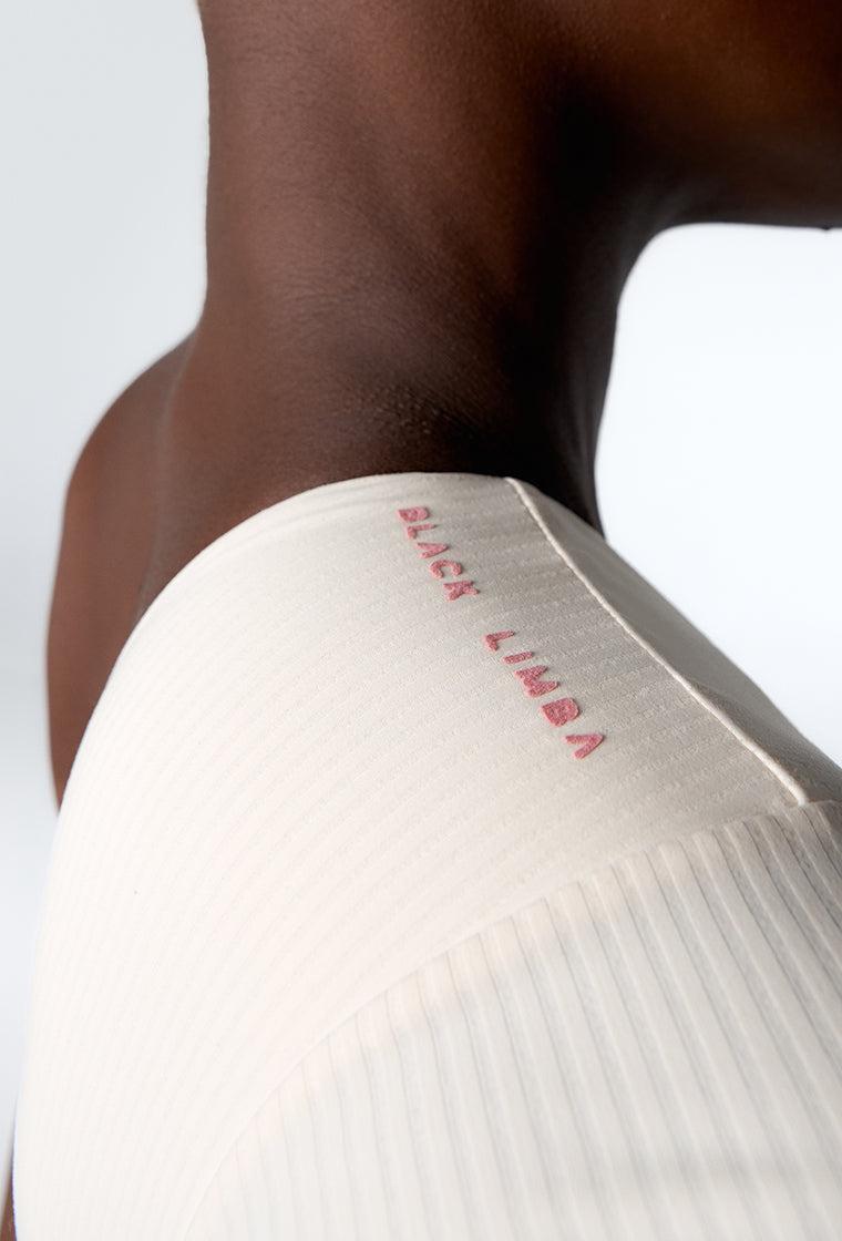Body deportivo Carm - Cream-Black Limba