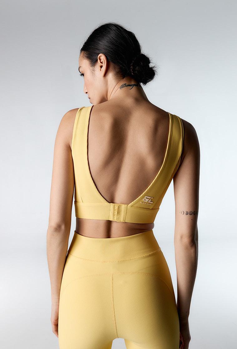 Top deportivo de sujeción media Riva - Soft yellow-Black Limba