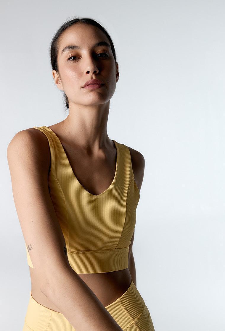 Top deportivo de sujeción media Riva - Soft yellow-Black Limba